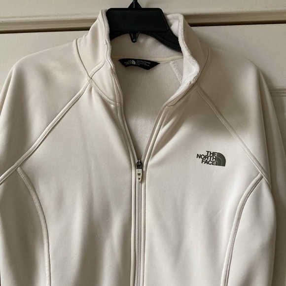 The north face cream color zip up jacket with front side pockets. 27 inches long - Picture 3 of 6